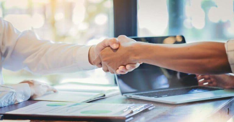 Businessman handshake at business meeting after negotiations with business partners.